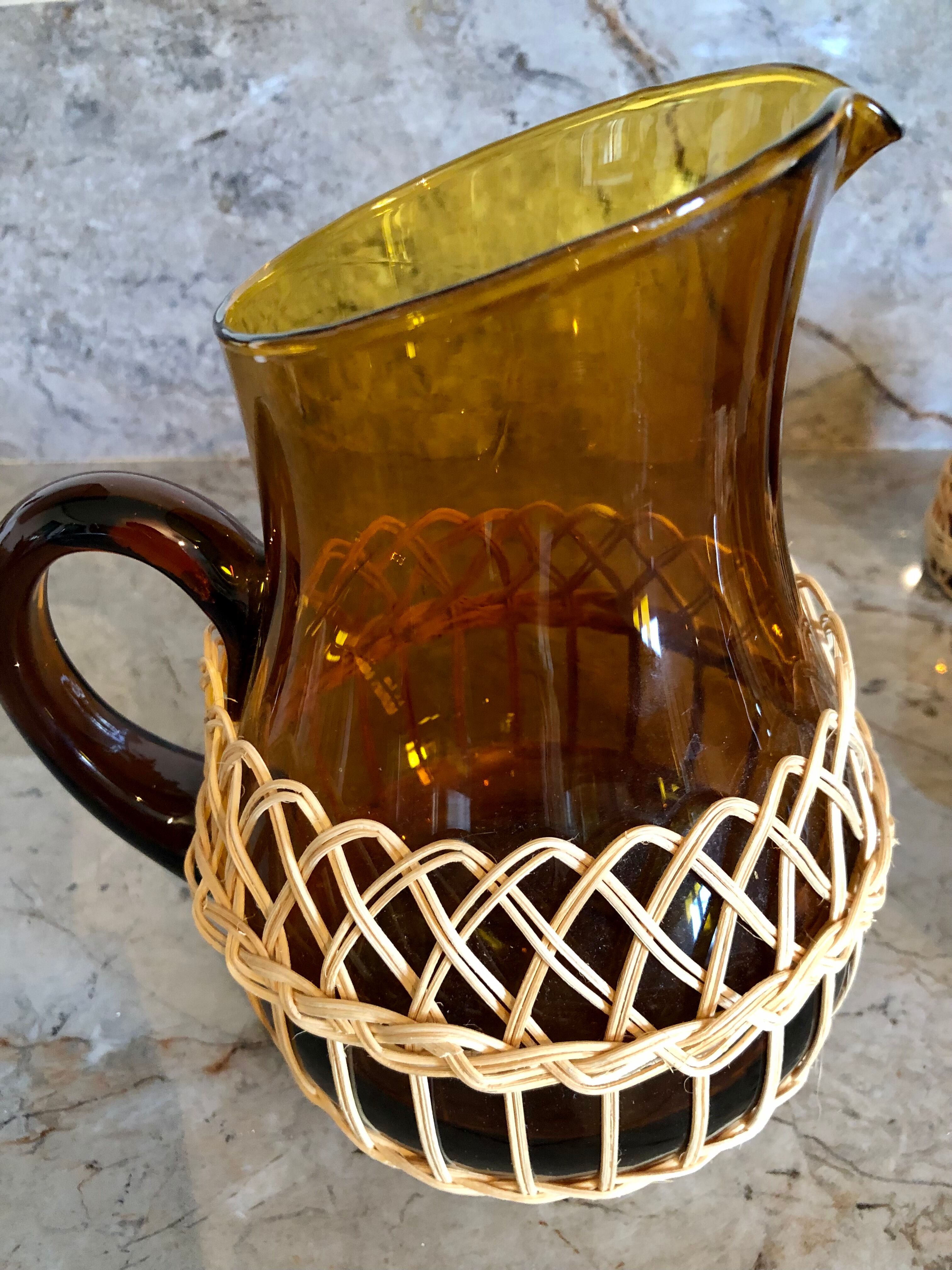 Pitcher and amber glasses and rattan