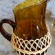 Pitcher and amber glasses and rattan