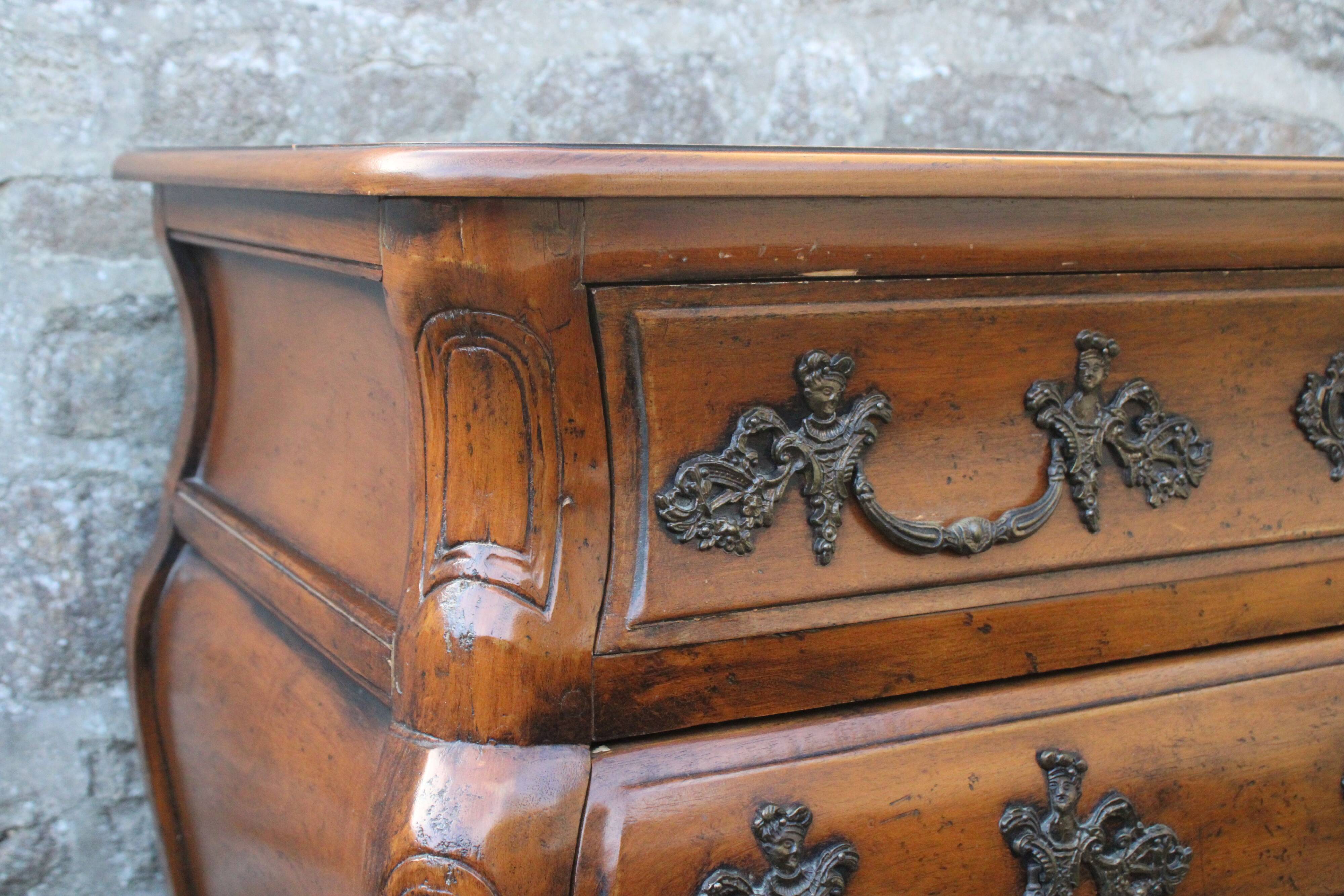 Curved Louis XV style chest of drawers known as a “tomb”