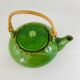 Green earthenware tea set with cabbage pattern, vintage 1970s.