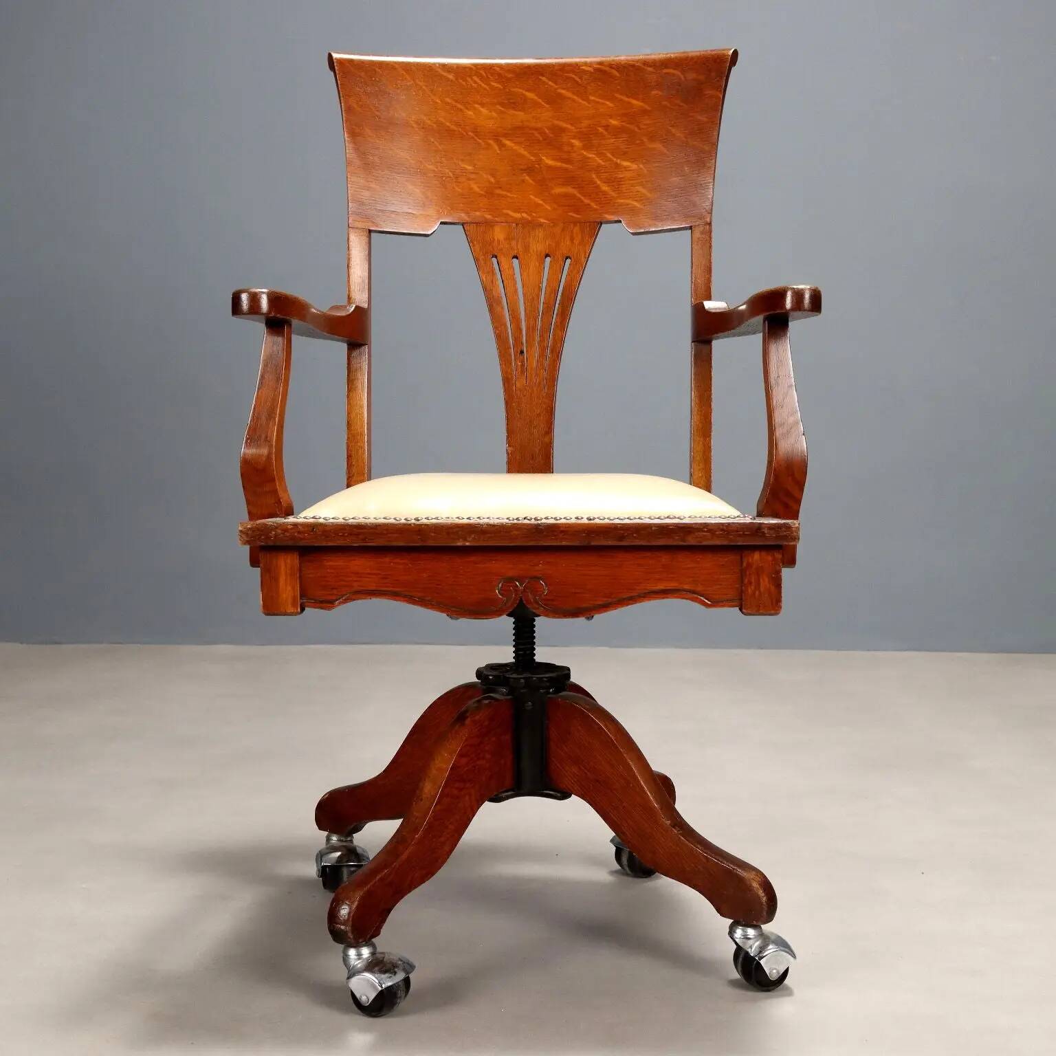 Antique oak swivel chair with wheels UK 20th Century