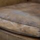 Vintage sheepskin armchair with a beautiful light colour and elegant legs