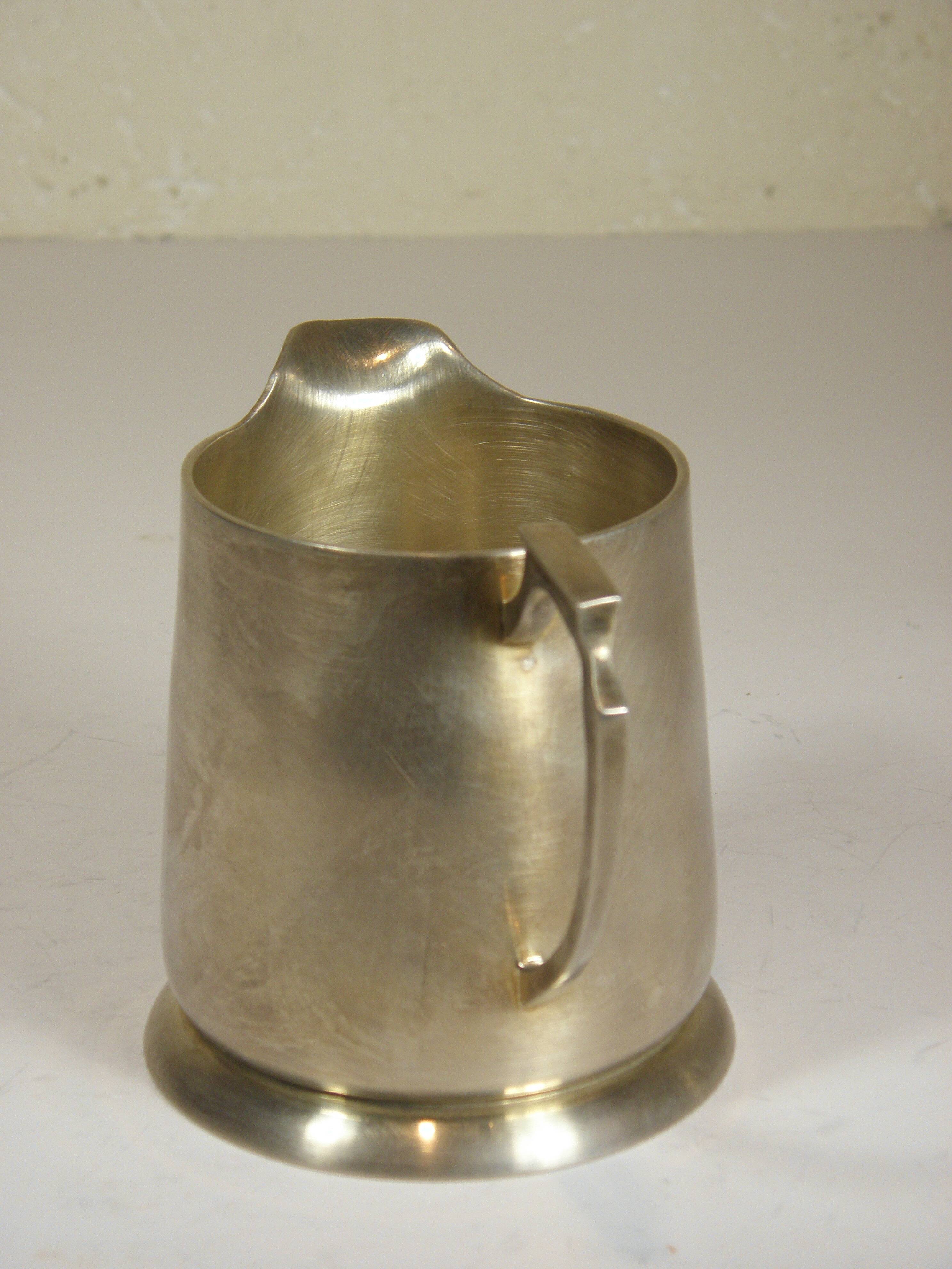 Silver-plated metal coffee pot and milk jug