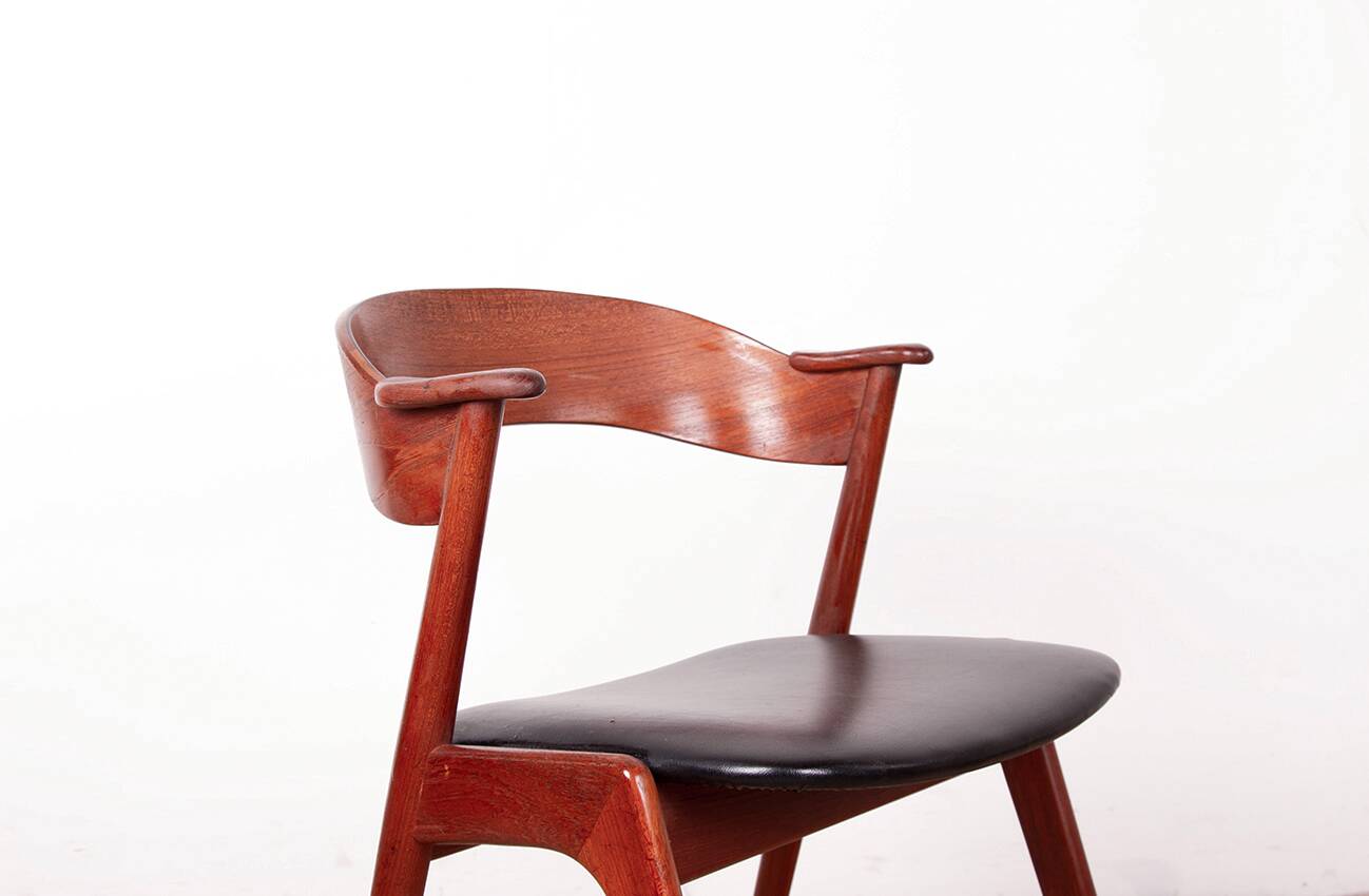 Danish armchair in teak and Skai, by Henning Kjaernulf for Korup Stolefabr.