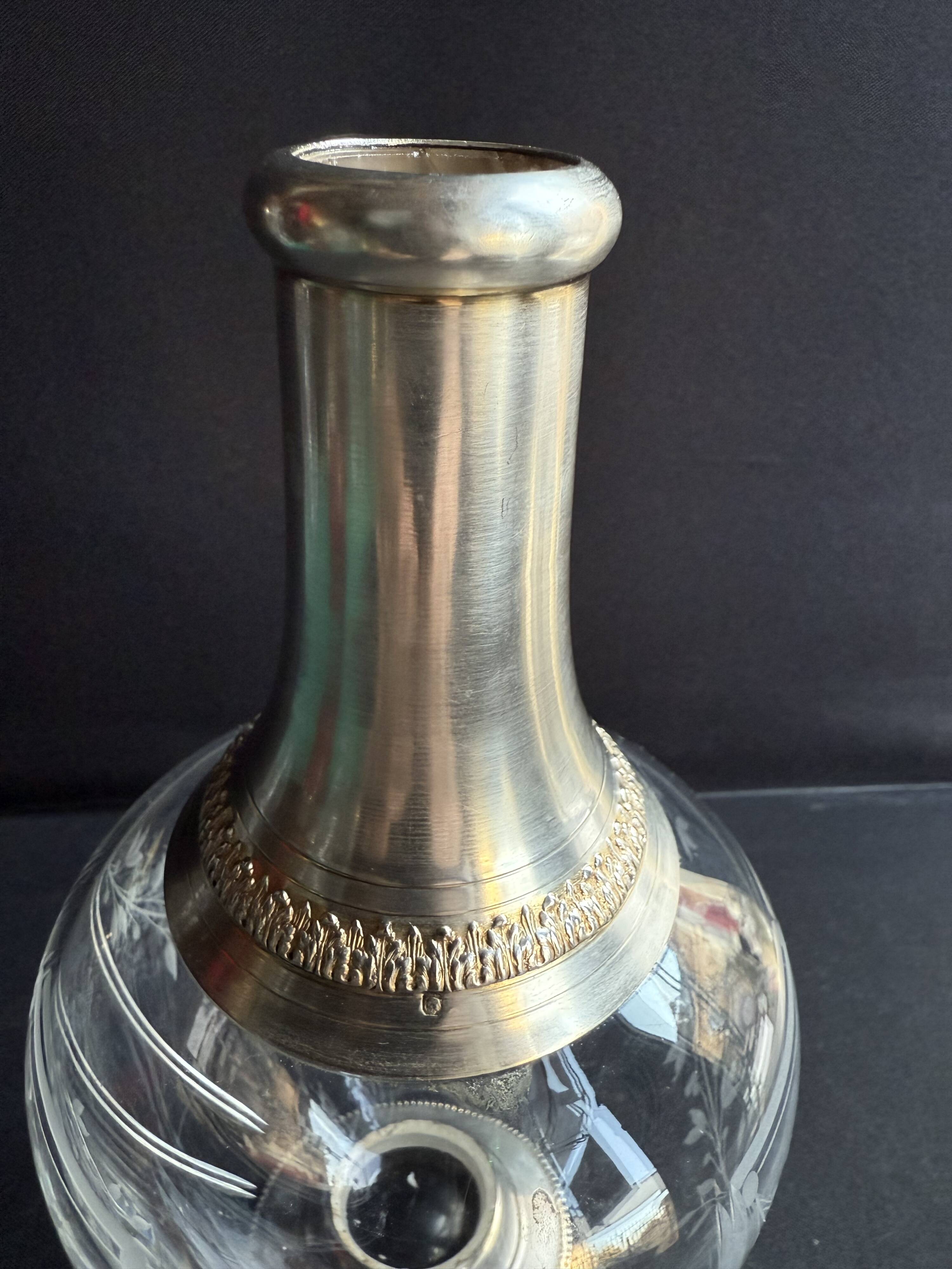 Cut crystal carafe with silver frame