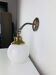 Brass wall light with opaline globe, vintage, 1950s.