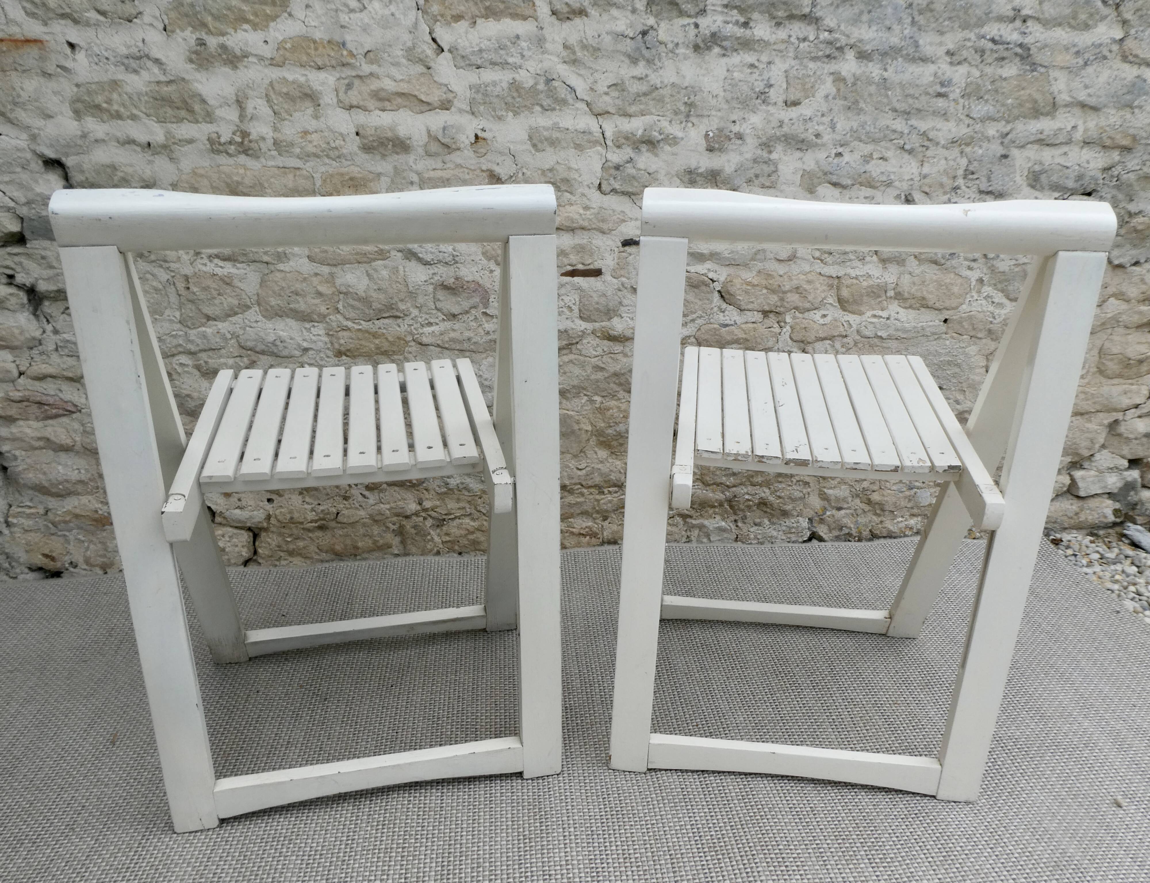 Pair of folding wooden chairs, white patina, circa 1960.