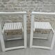 Pair of folding wooden chairs, white patina, circa 1960.