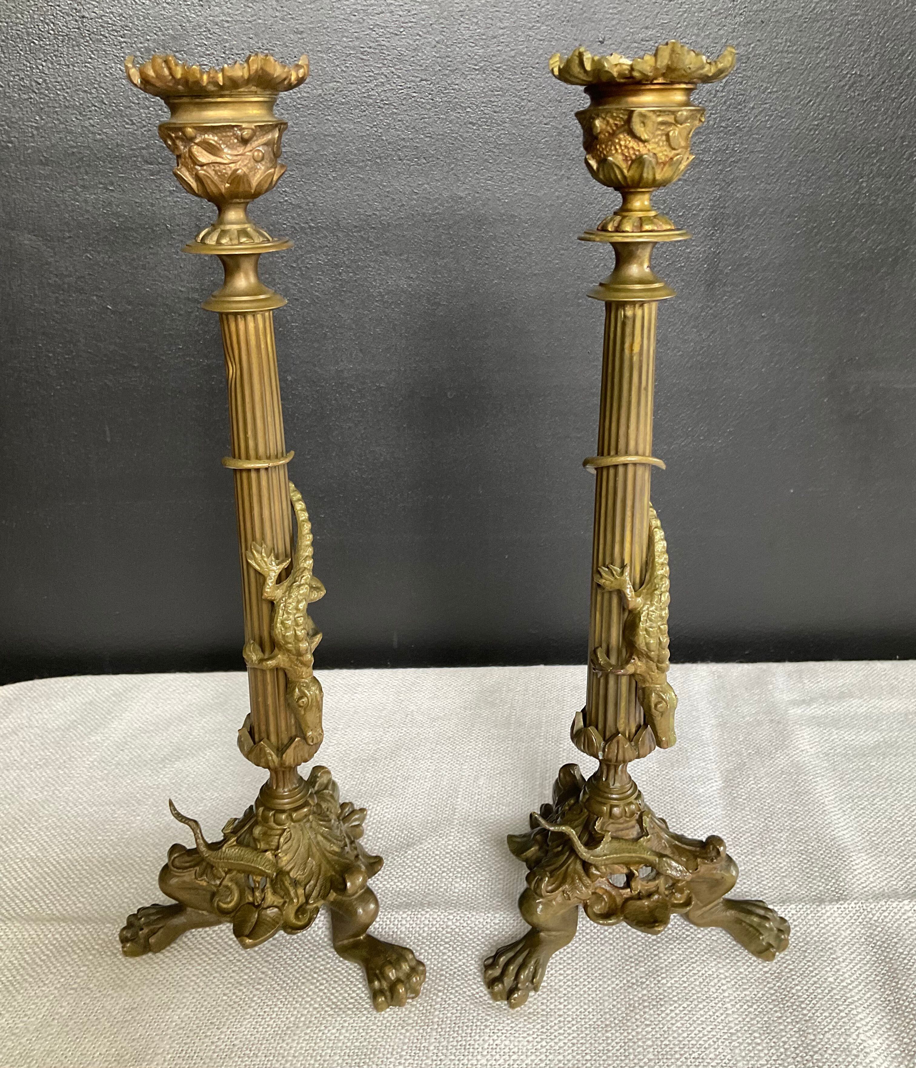 Pair of 19th-century gilded bronze candlesticks in Empire style.