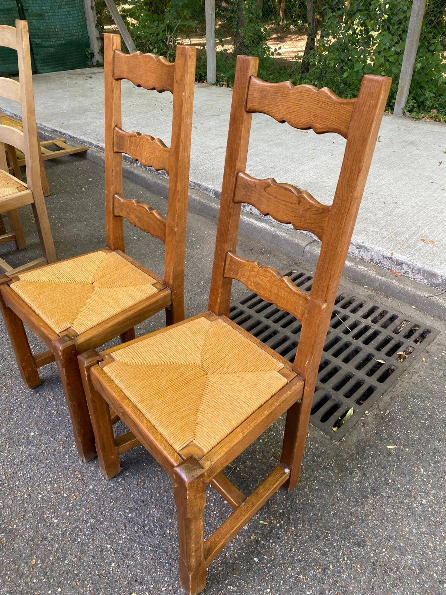 8 wooden dining chairs with straw seats, farmhouse style, high back.