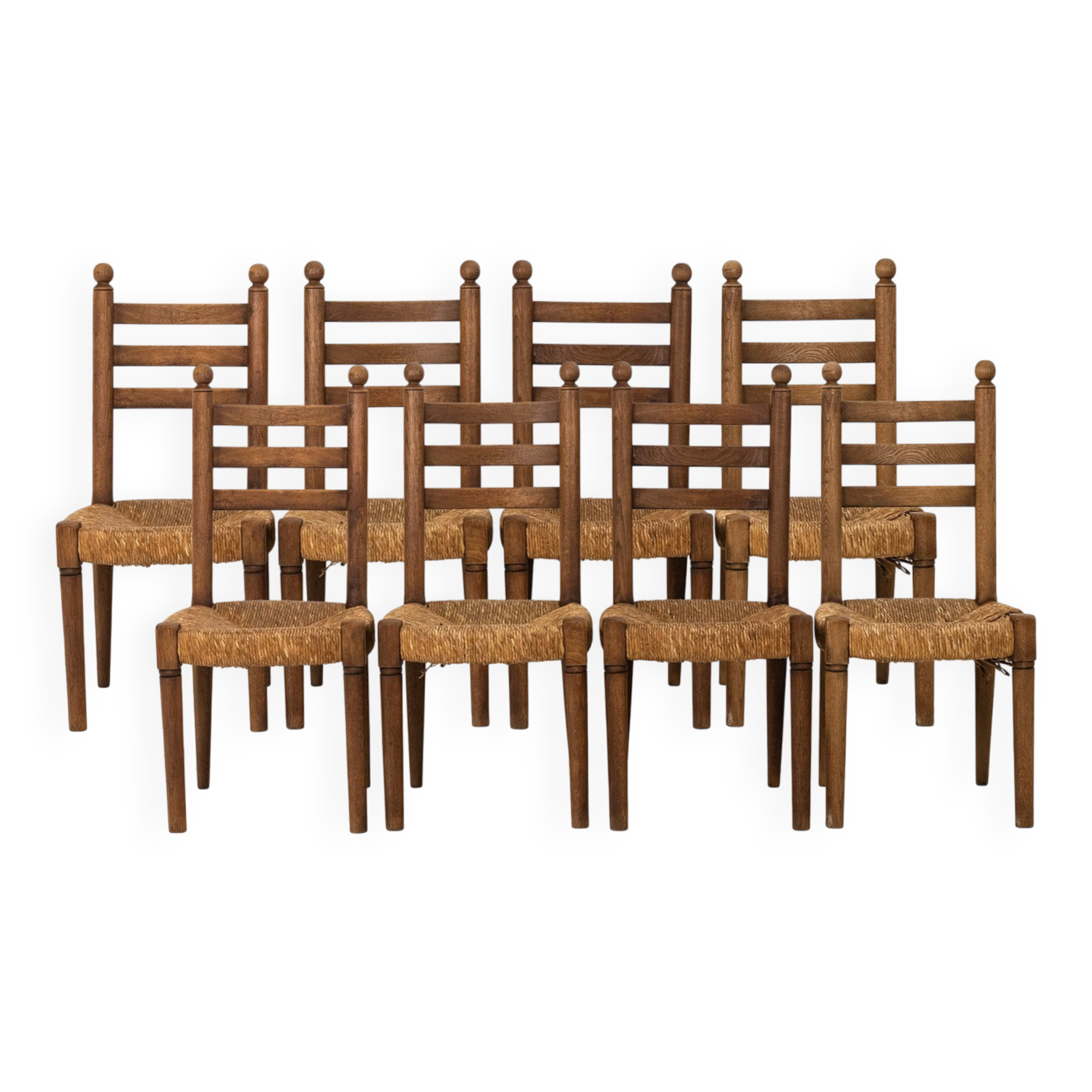 Ensemble de 8 chaises paillées en chêne. Années 1950.