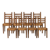 Set of 8 oak chairs with rush seats. 1950s.