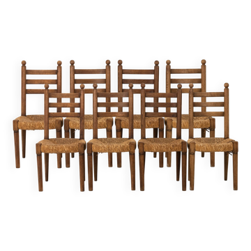Set of 8 oak chairs with rush seats. 1950s.