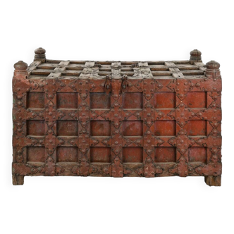 Large wooden and metal chest with red patina