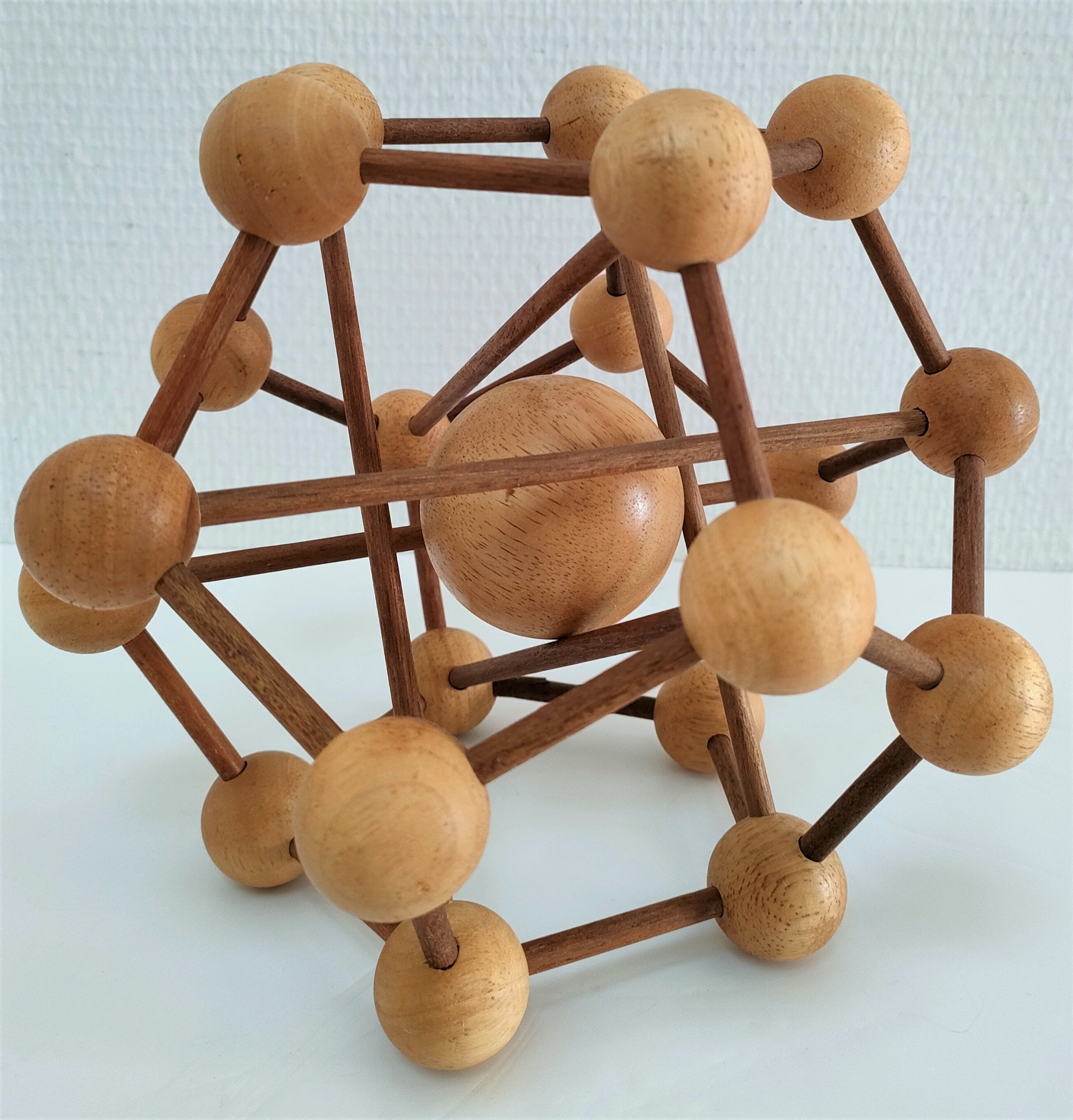 Sculptural modeling of a solid wood atom contemporary design