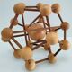Sculptural modeling of a solid wood atom contemporary design