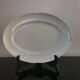 Oval white earthenware dish stamped K&G, Lunéville