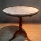 Circular pedestal table with white marble top