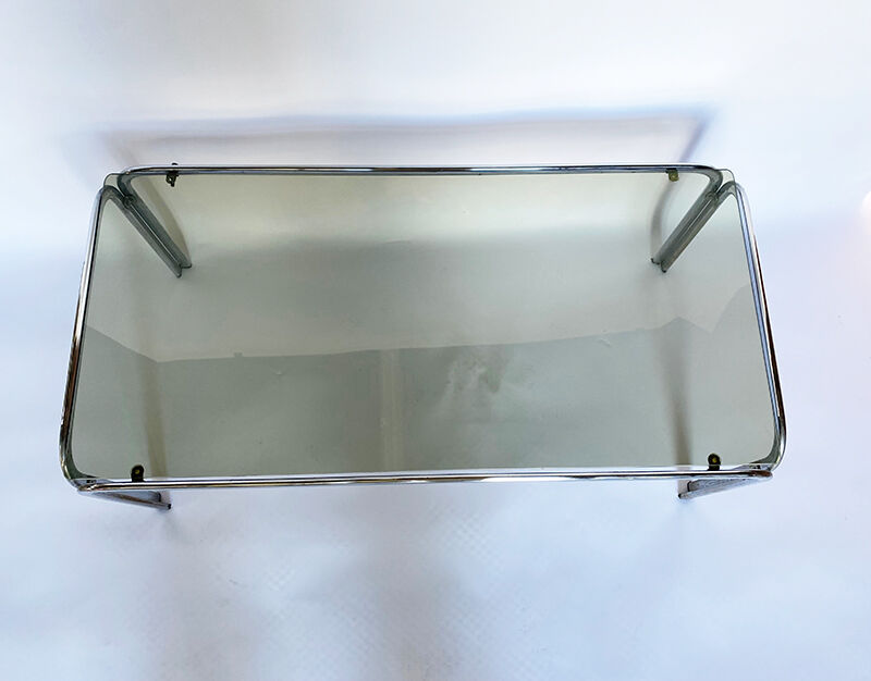 Metal table and smoked glass