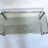 Metal table and smoked glass