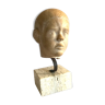 Bust sculpture of a young boy in hard stone