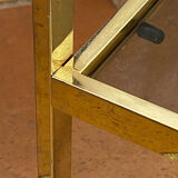 Gold metal and smoked glass console table.