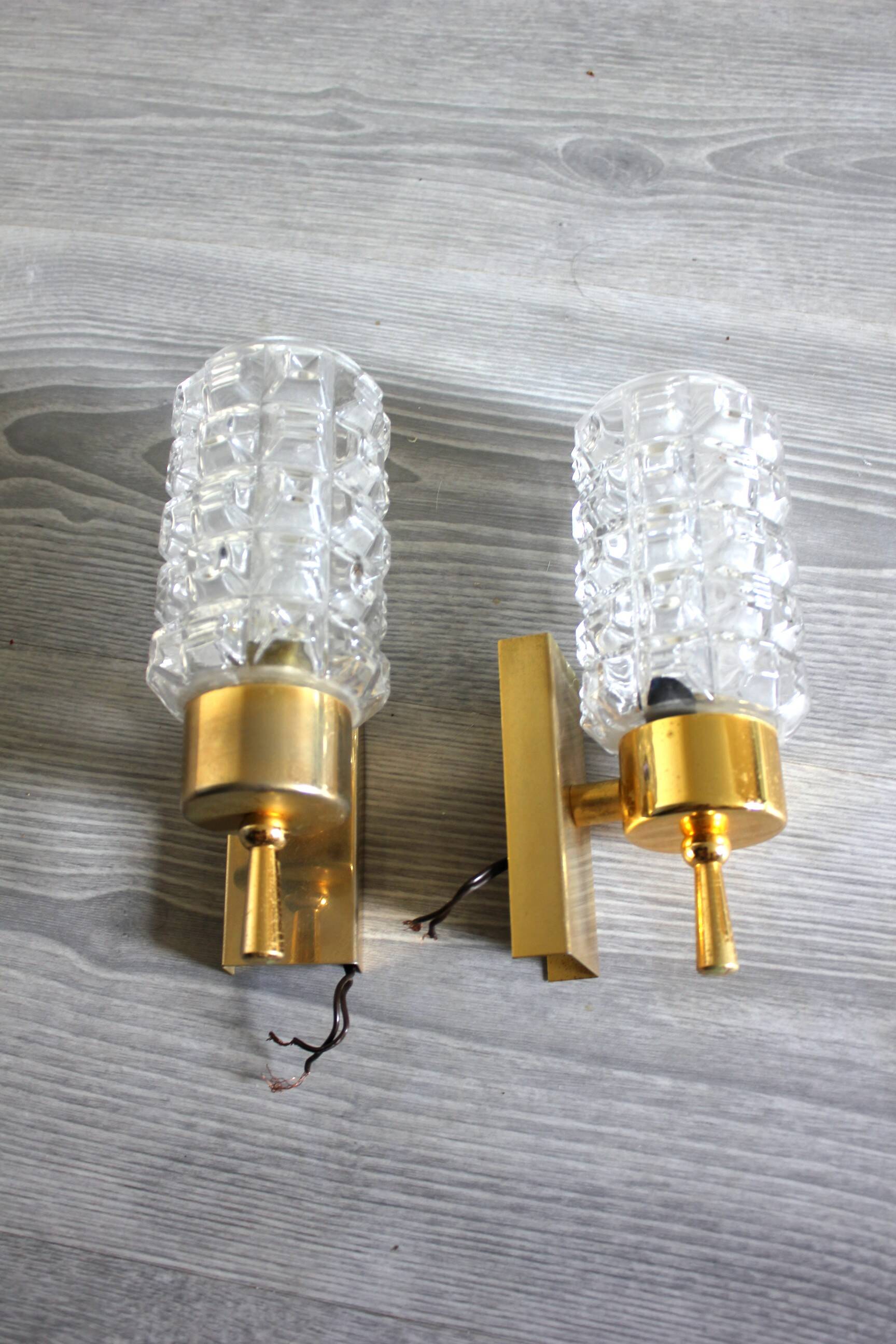 Pair of vintage wall sconces in gilded brass with moulded glass.
