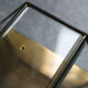 Wall sconce in brass and glass