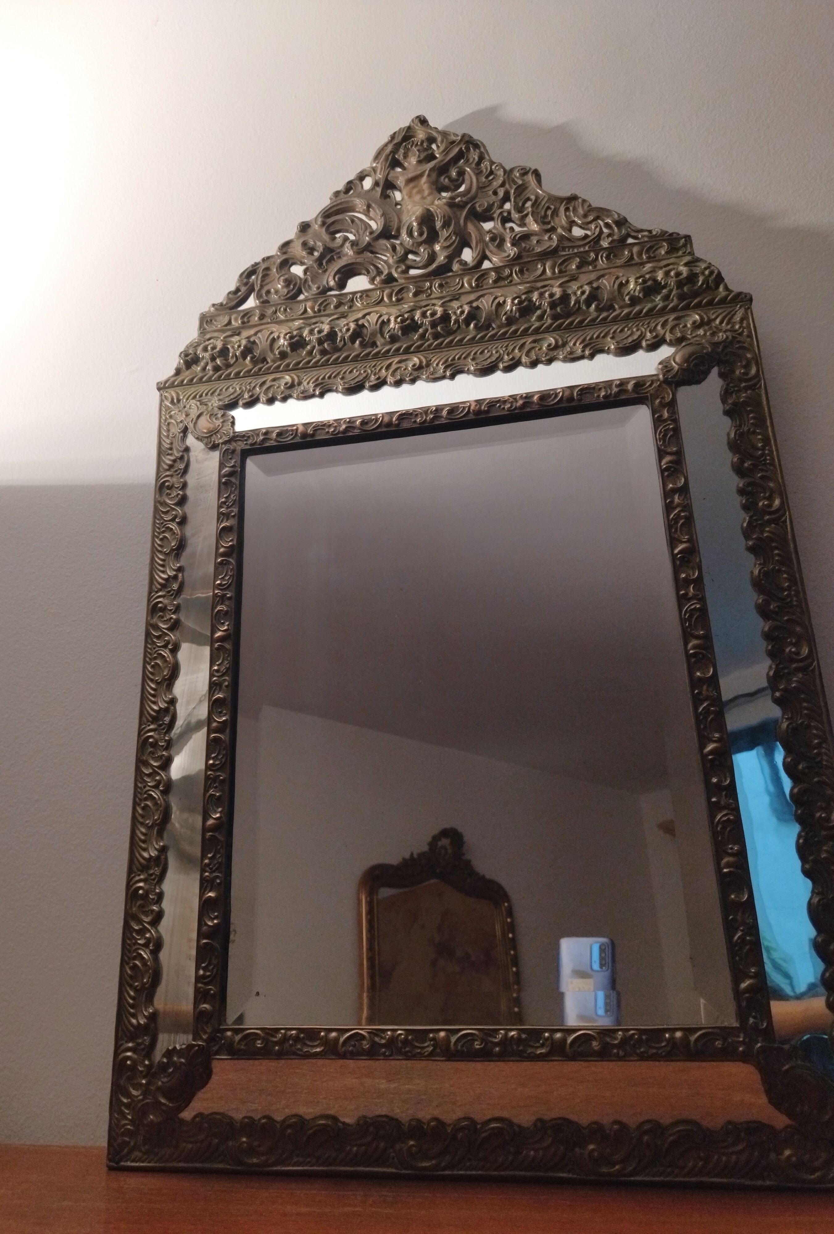 Repelled brass pareclose mirror