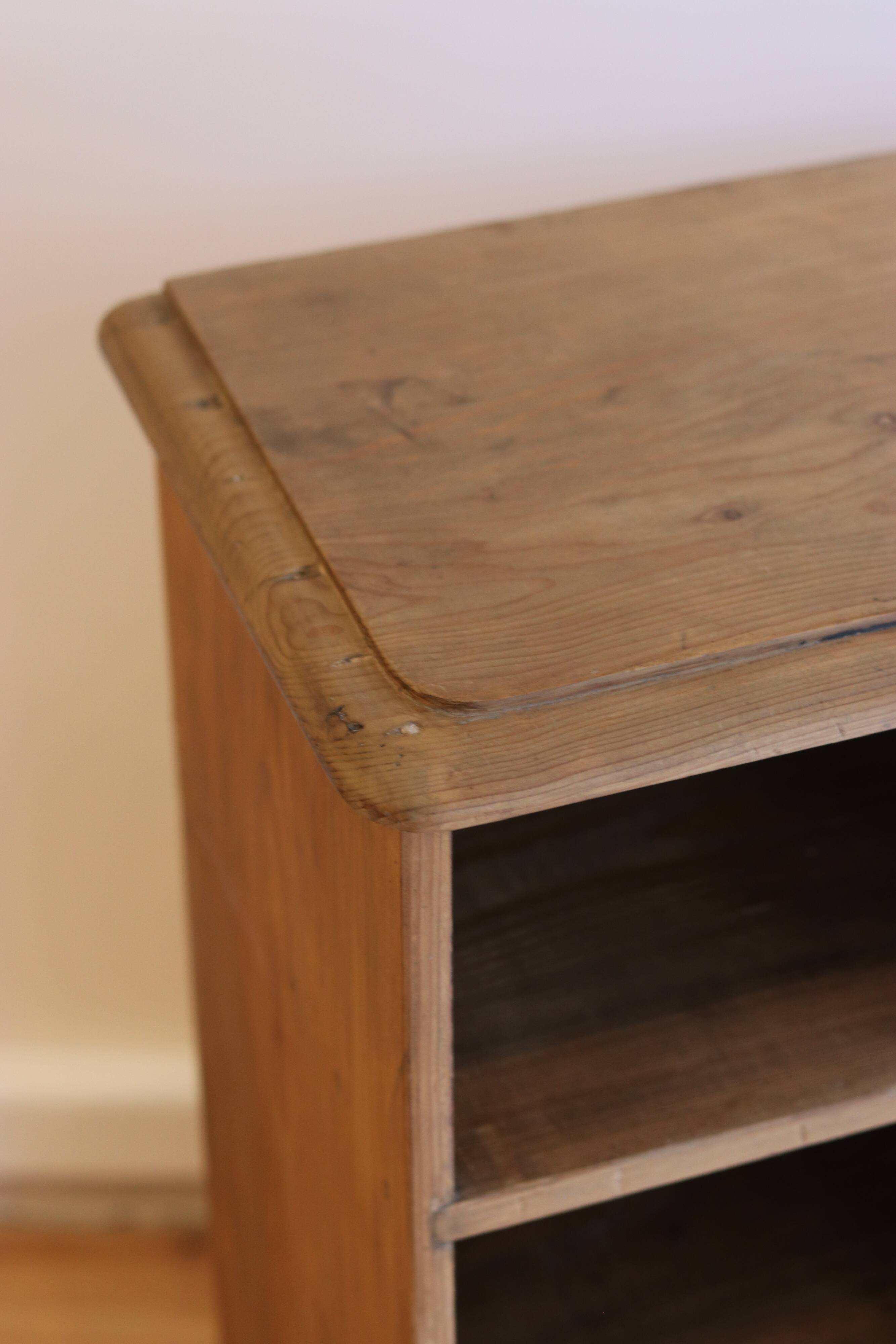 Large storage unit with compartments in waxed pine, early 20th century.