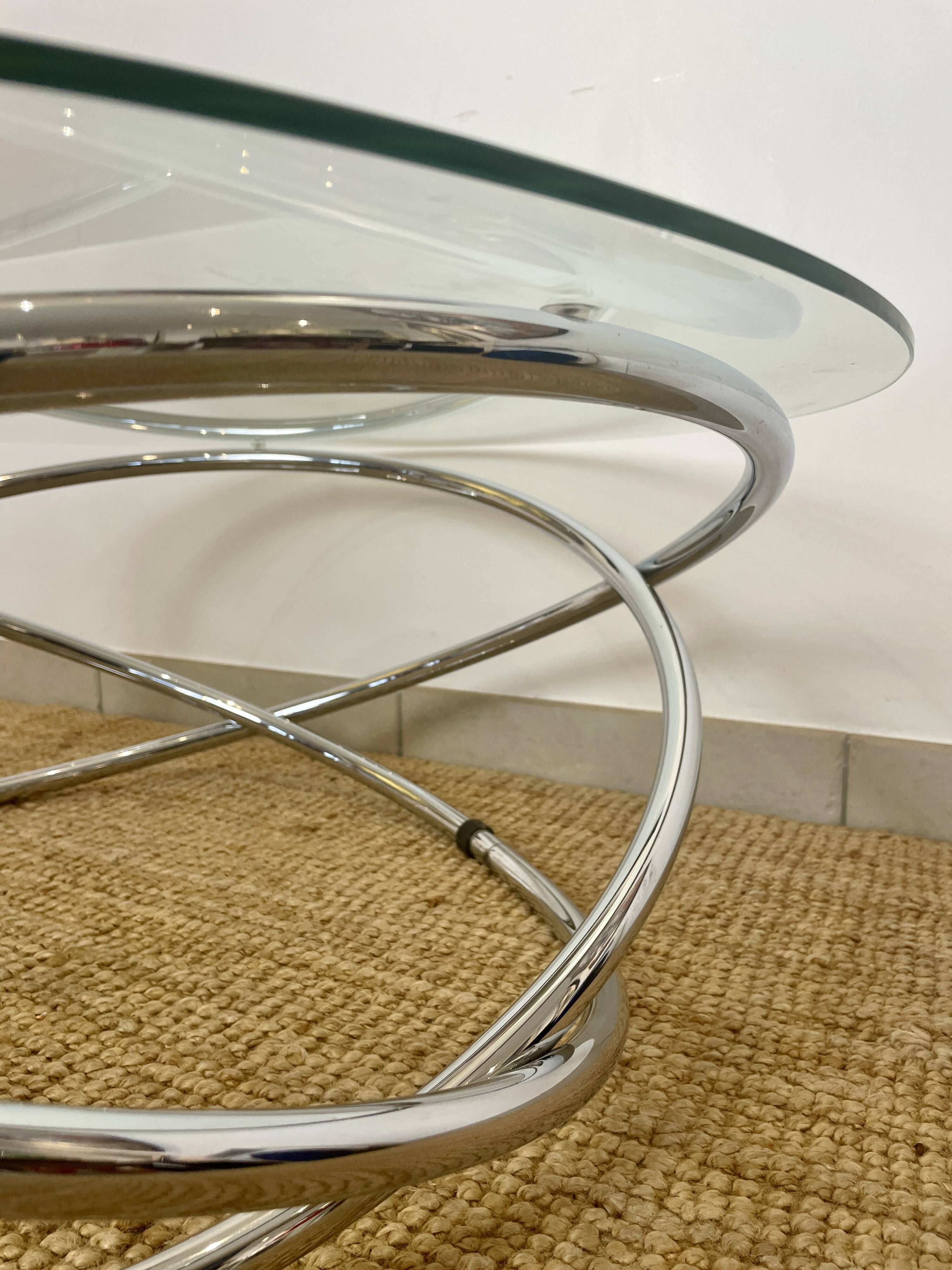 Coffee table with glass top and chrome tubular base