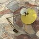 Diabolo wall lamp lunel yellow in the style of René Mathieu Guariche, star sheet metal.