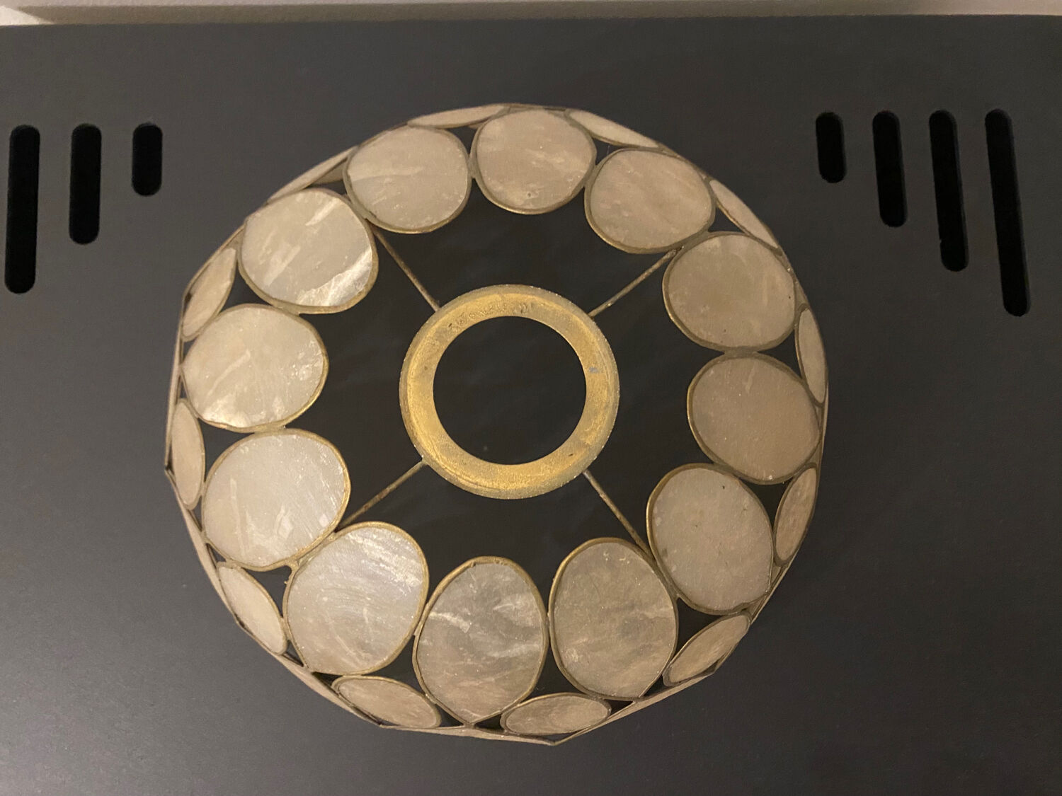 Mother-of-pearl and brass suspension