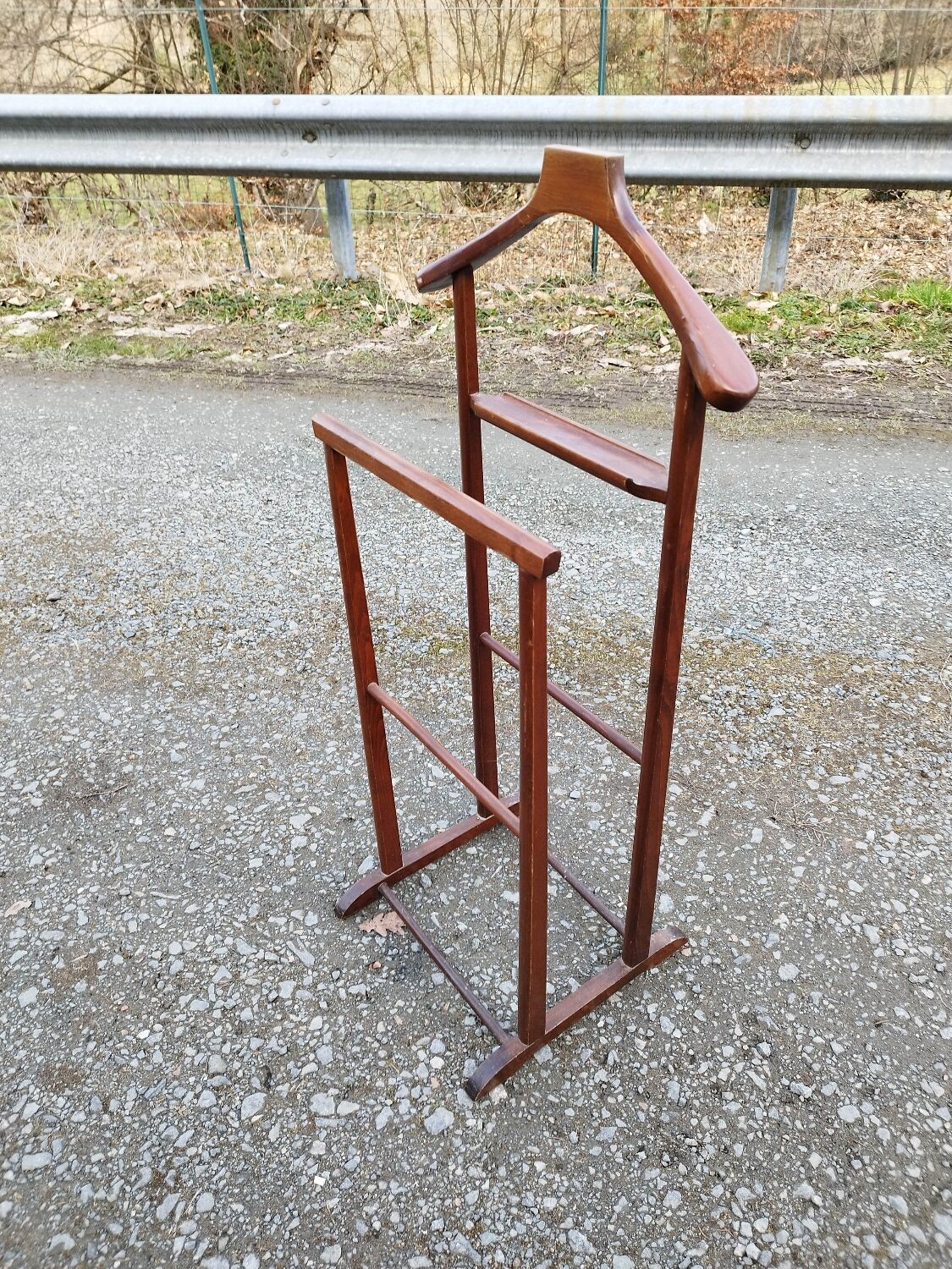 Valet wearing double wood coat rack