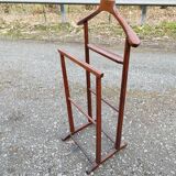 Valet wearing double wood coat rack