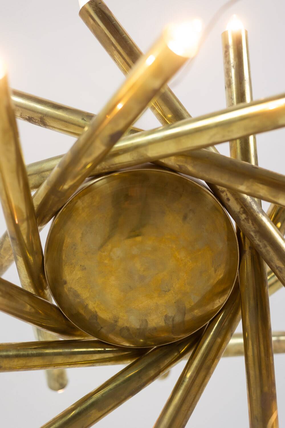Pair of matte gold-plated brass chandeliers. Italian work from the 1970s.