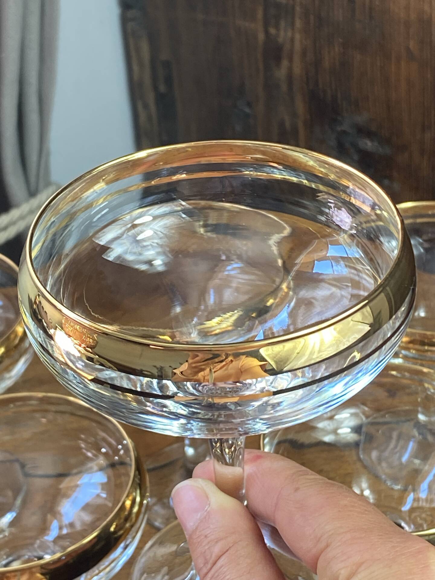 Champagne coupes or cocktail glasses with gilding