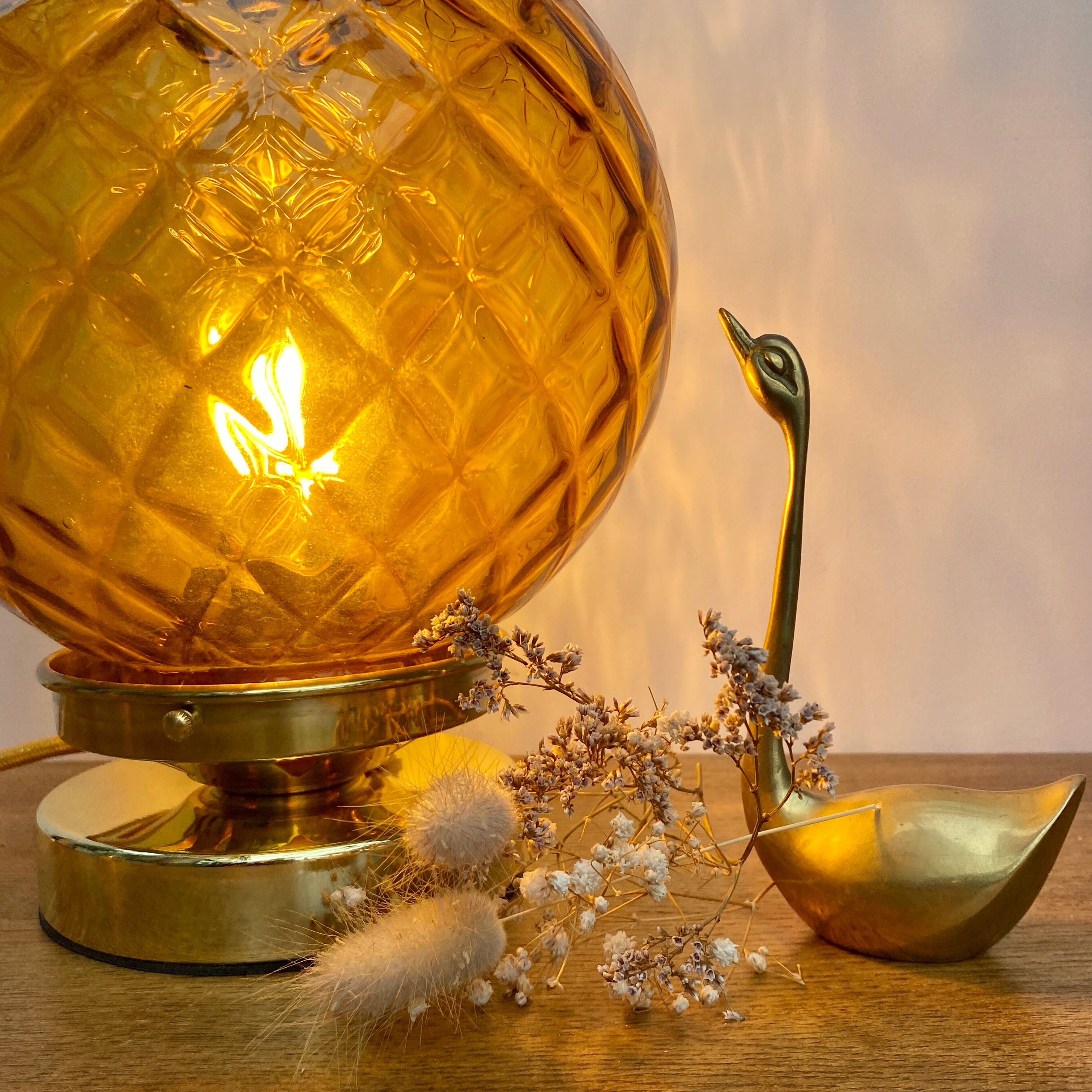 Vintage amber glass globe laying lamp with brass detail