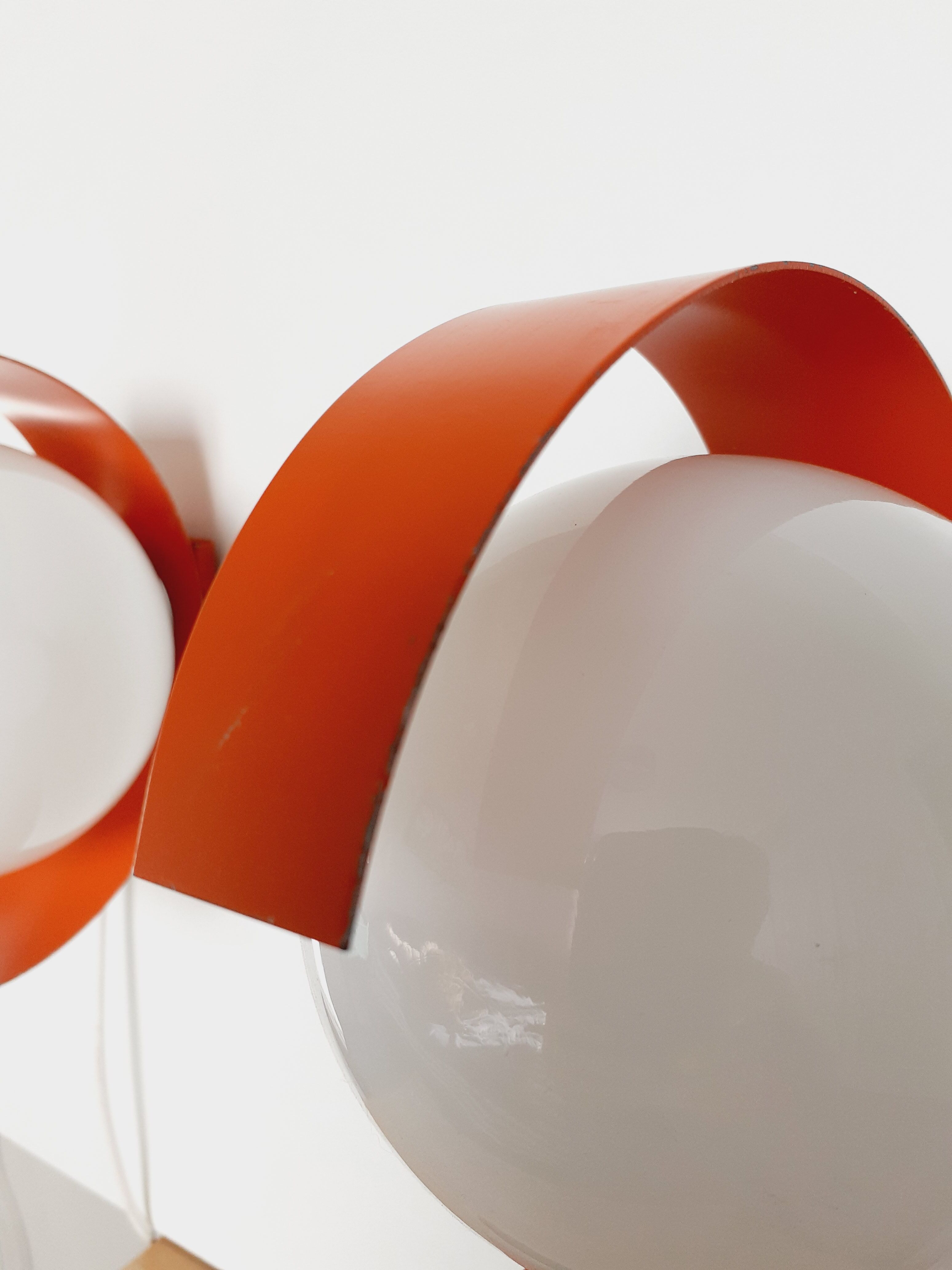 Pair of orange space age wall lamps