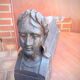 Pair of cast-iron chenet characters with laurels