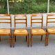 4 chaises de salle à manger en bois massif paillées 80s