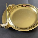 Round brass pocket tray with club and golf ball decoration.