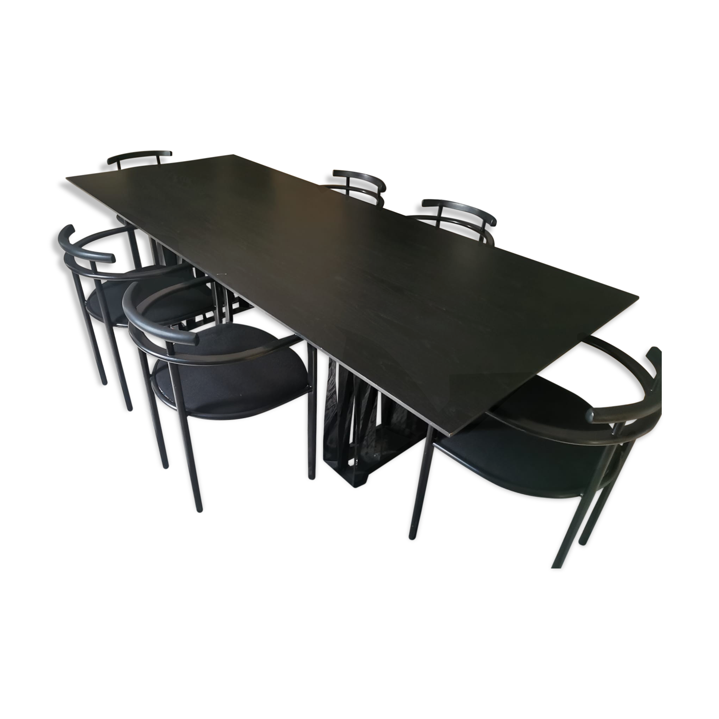 Black dining room table, wooden, rectangle with upholstered chairs.