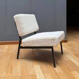 Pair of vintage armchairs, black metal and sheepskin fabric, France 1950.