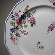 4 flat plates by Bernardaud, Limoges porcelain, floral decoration from the 1920s to 1950s.