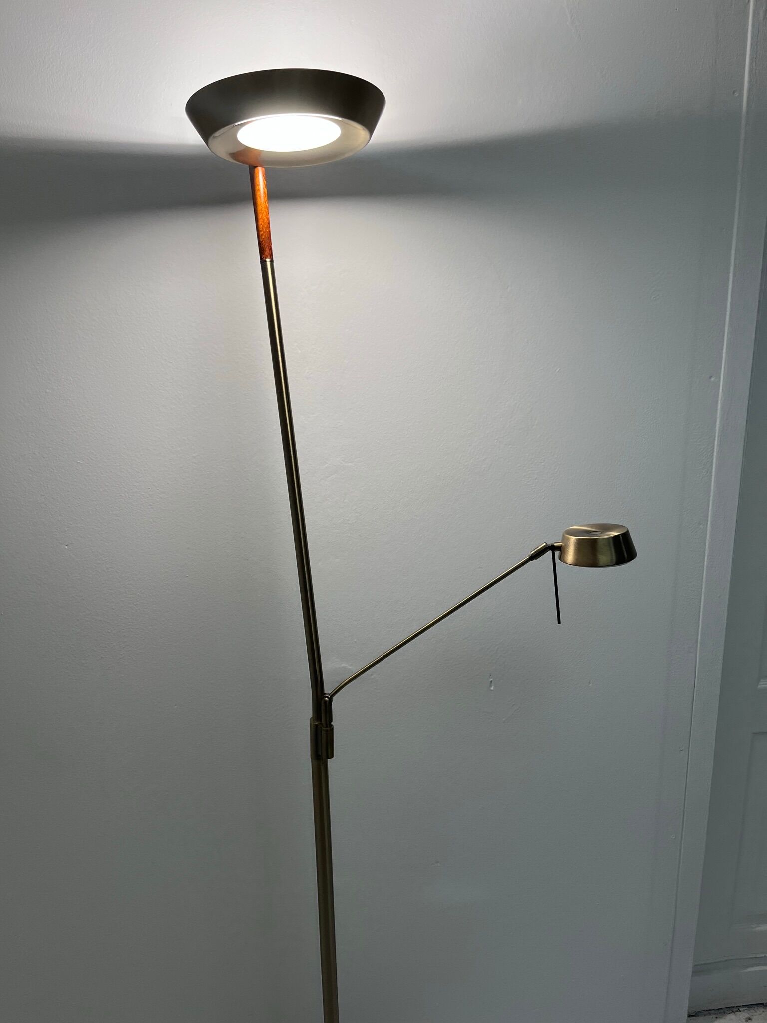 Golden metal floor lamp with reading light