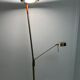Golden metal floor lamp with reading light
