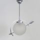 Suspension in chromed metal and glass, space age, arrow crossing a globe. Seventies