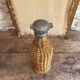 Woven wicker bottle