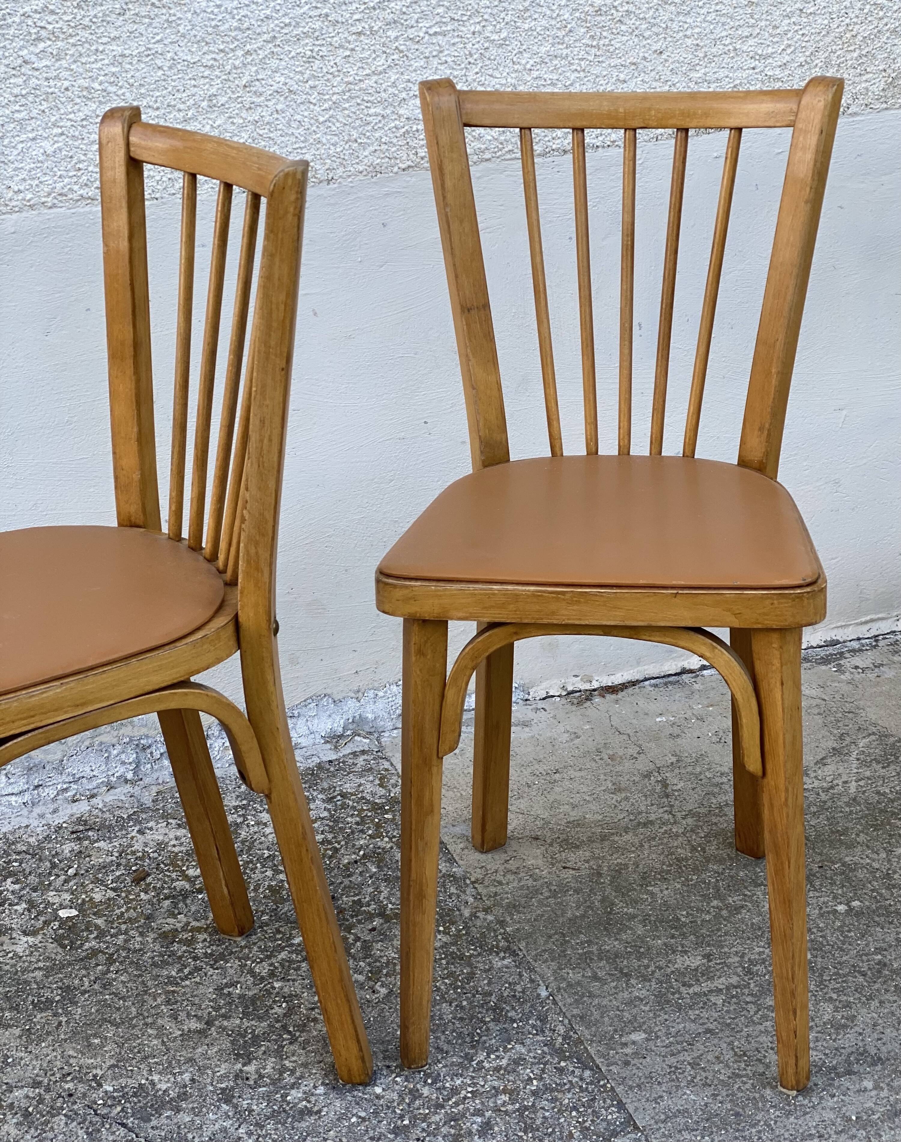 Série de 4 chaises bistros vintage 1950-60 assises Skaï